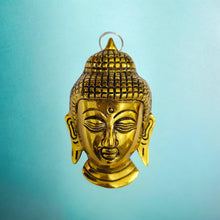 Wall Hanging of Lord Buddha Face , Colour- Golden, Material- Brass, for gifting , home decoration, brass decor ( pack of 1 )